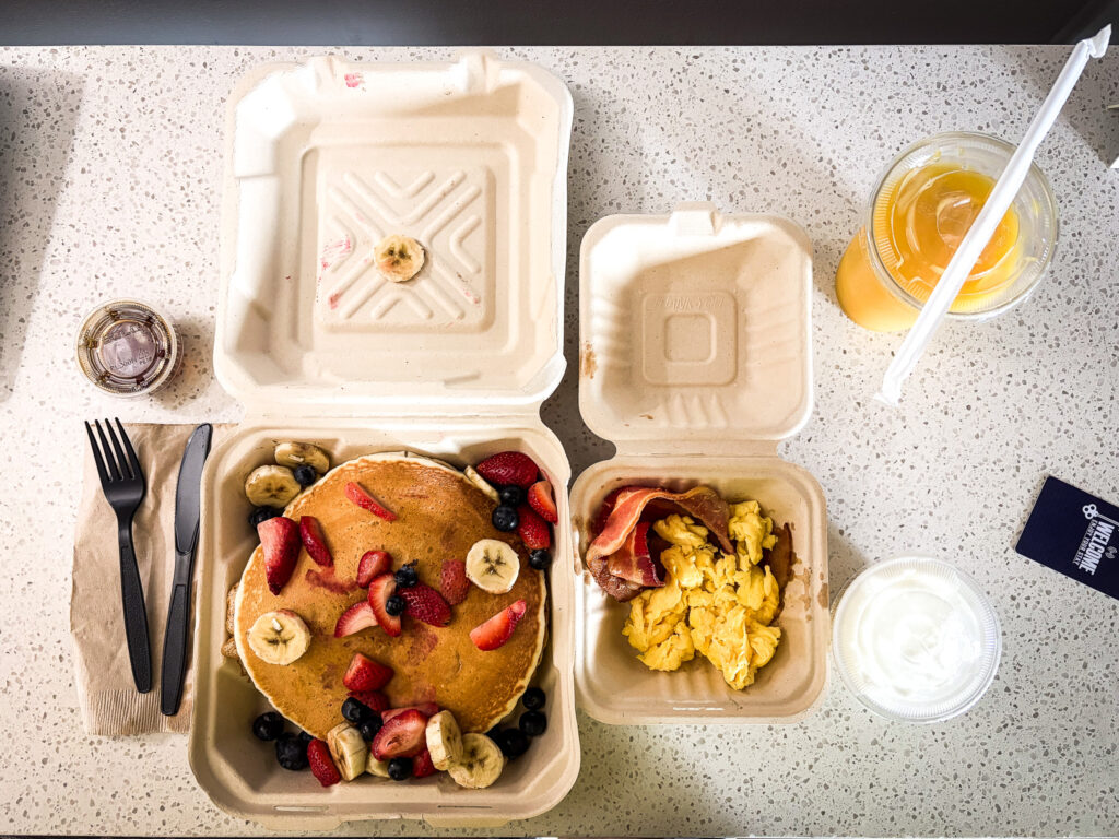 Pat's Cafe Pancake Special delivered via Uber Eats, laid out on the desk at La Luna Inn, Marina District, San Francisco CA